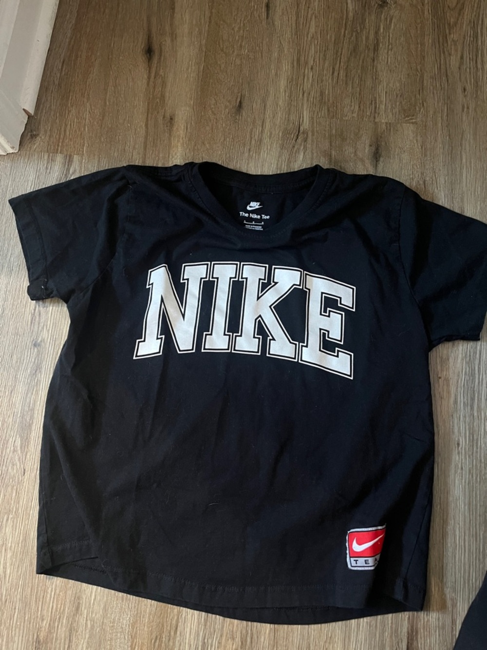 The Nike Tee Black T-Shirt with White Block Logo